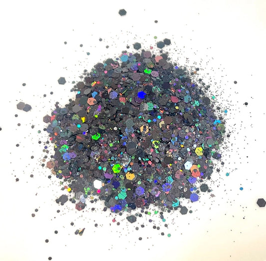 Holographic black glitter with multicoloured reflections on a white background