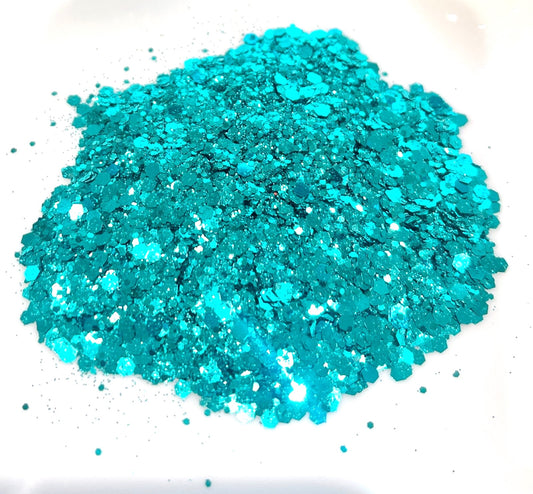 Turquoise glitter on a white background
