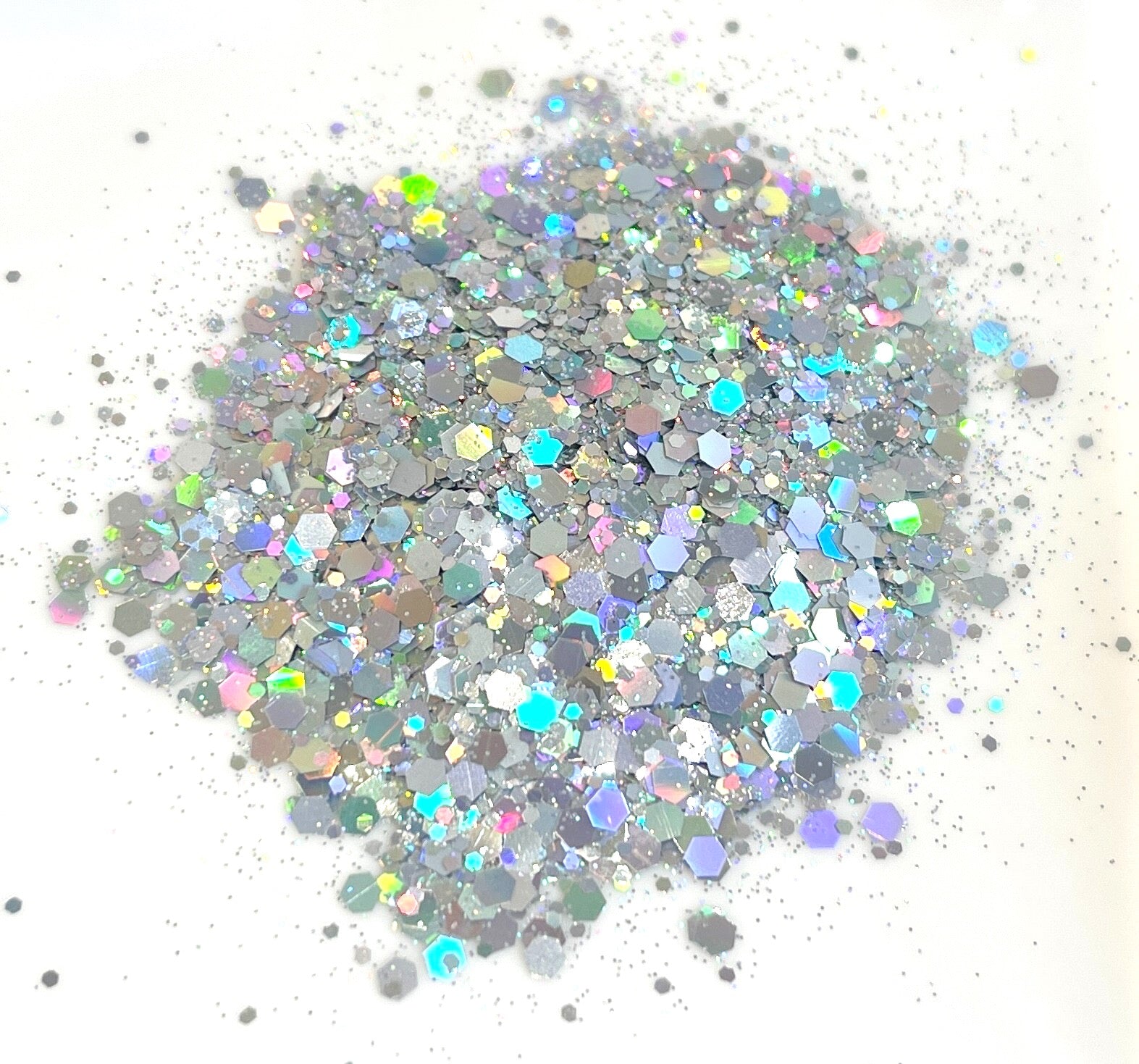 Holographic silver glitter on a white background