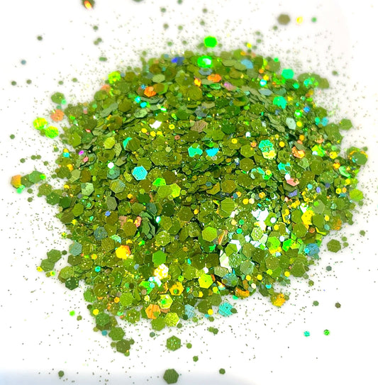 Green holographic glitter on a white background