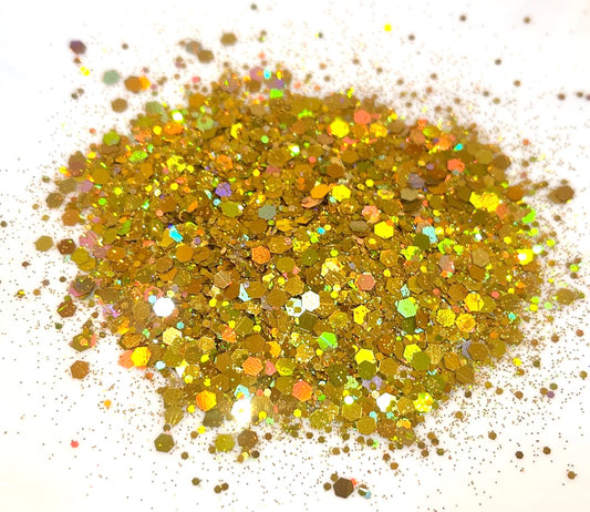 Gold coloured glitter on a white background