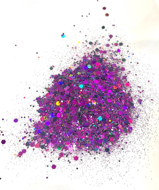 purple and violet holographic glitter on a white background