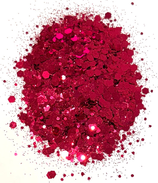 Red/pink chunky glitter on a white background