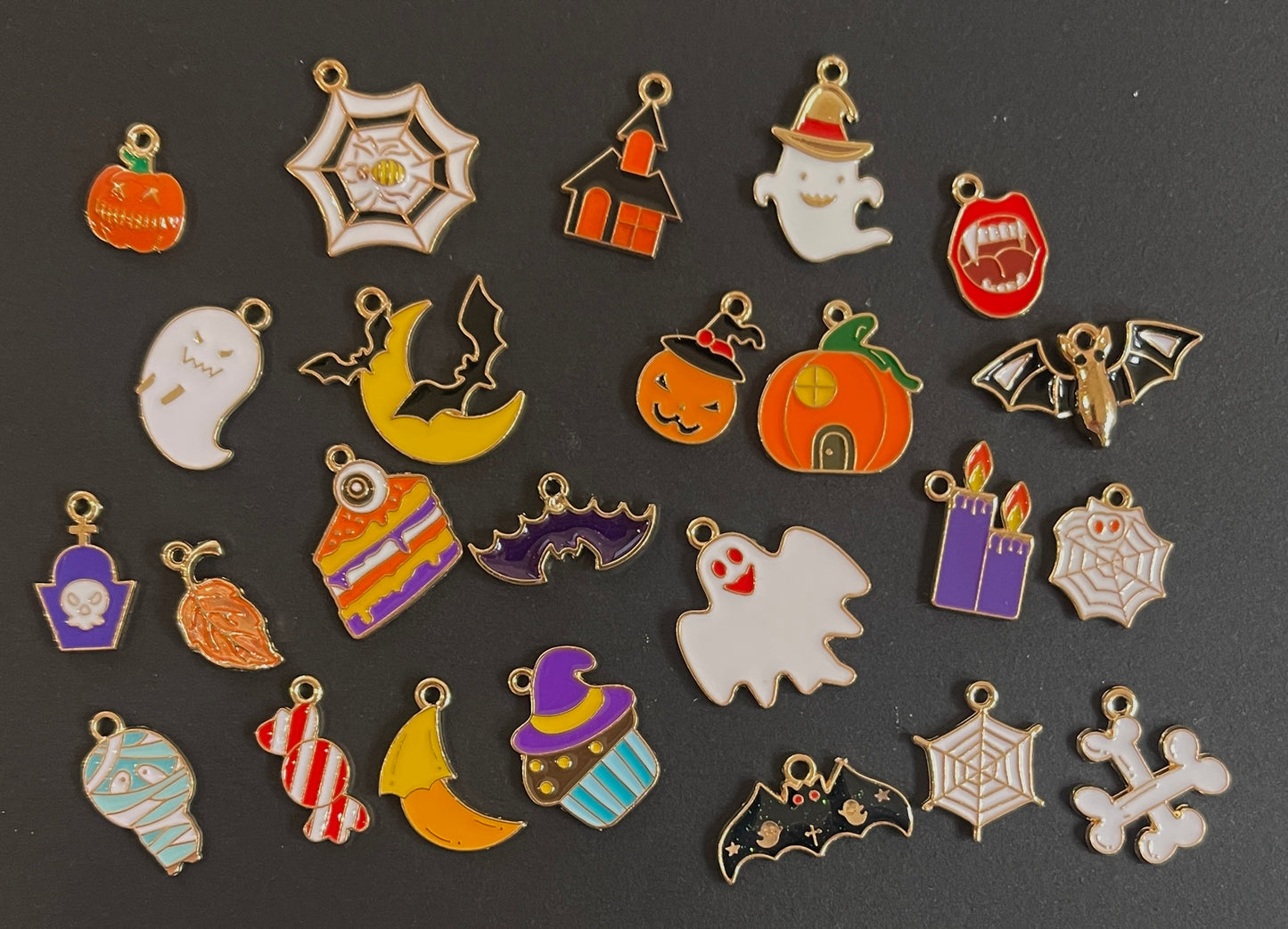 Collection of Halloween-themed charms on a dark background