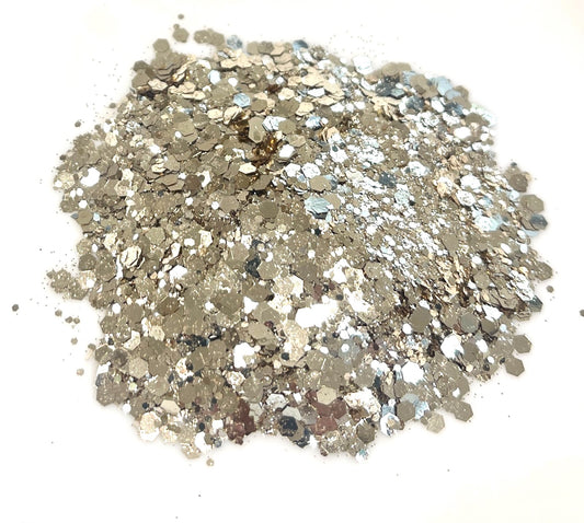 Pile of metallic glitter on a white background
