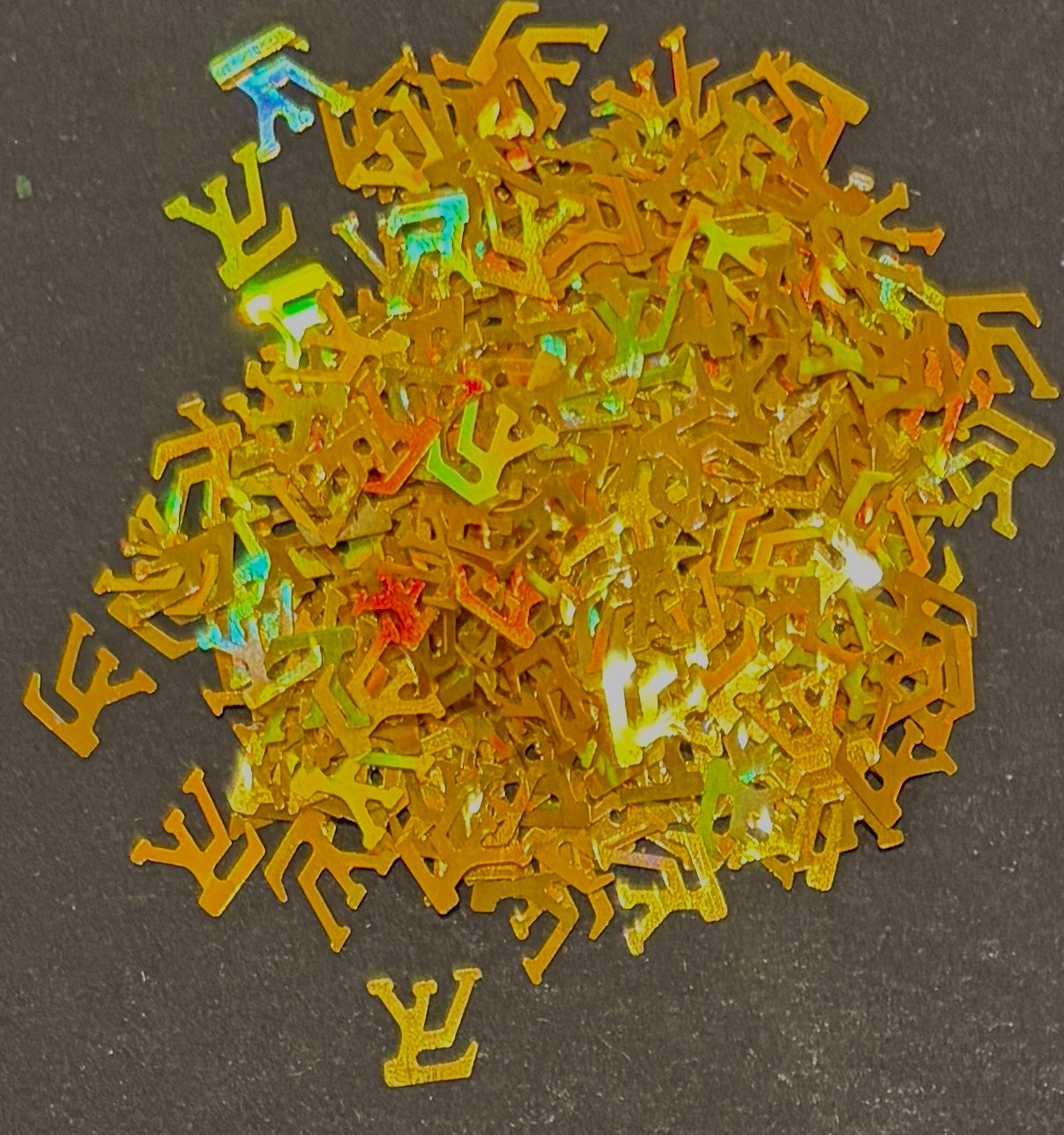 Holographic gold glitter confetti LV logo on black background
